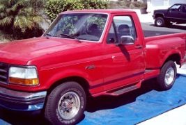 Before Picture of a Ford Pick Up Truck.  Picture shows an example of moderate oxidation on the paint. The truck’s paint is dull and lifeless.