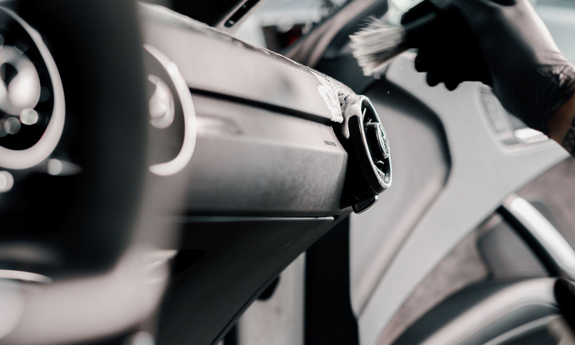 Machine polishing a white car during a Las Vegas exterior detail
