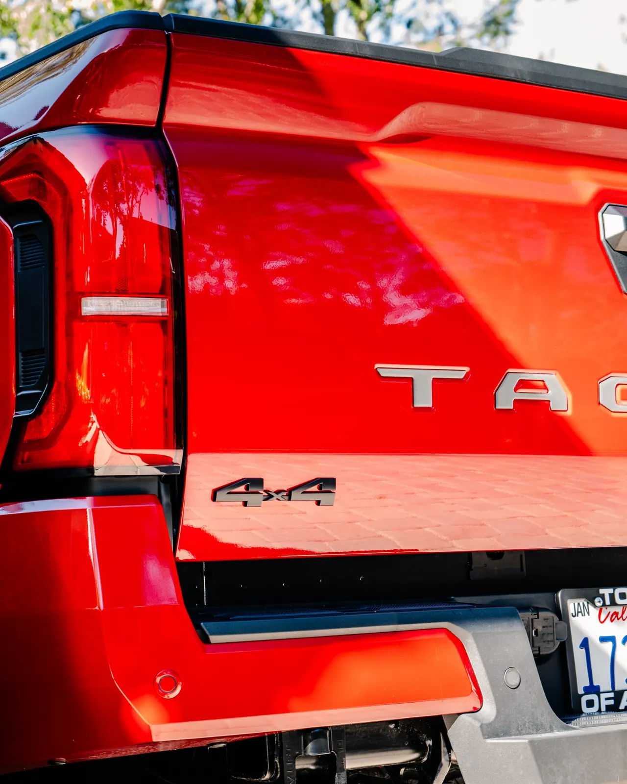 Professional exterior detailing on a red Toyota Tacoma showcasing Sabino's Famous Auto Detailing work.